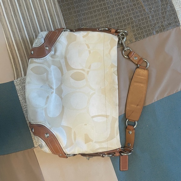 Coach Handbags - Coach bag. Medium sized. Cream and beige color. A few marks. Barely used.